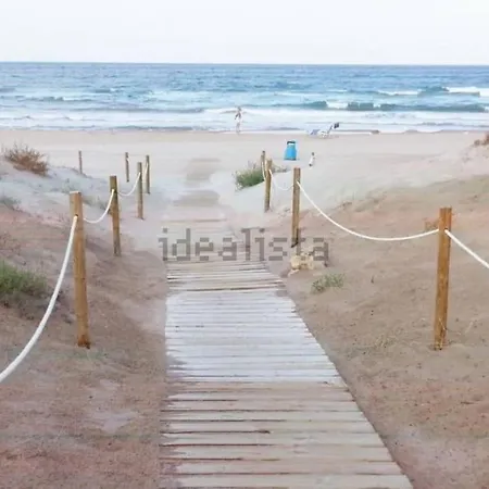 Hébergement de vacances Adosado En La Playa De El Perellonet Con Piscina, Pista Tenis
